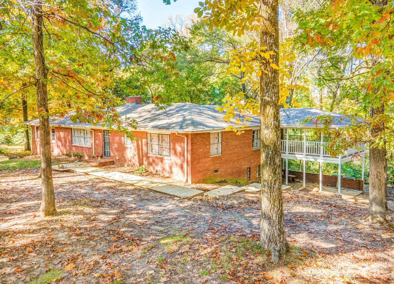 2725 Covington Pike Memphis, TN 38128 - Photo 18 of 26 a view of a house with backyard and a tree