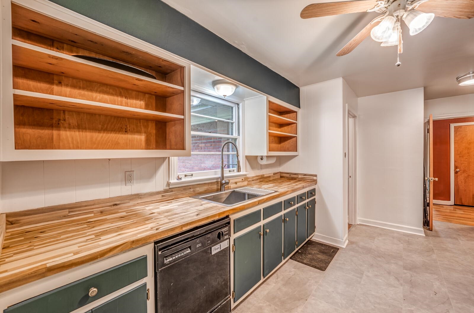 2725 Covington Pike Memphis, TN 38128 - Photo 2 of 26 a kitchen with a stove and a sink