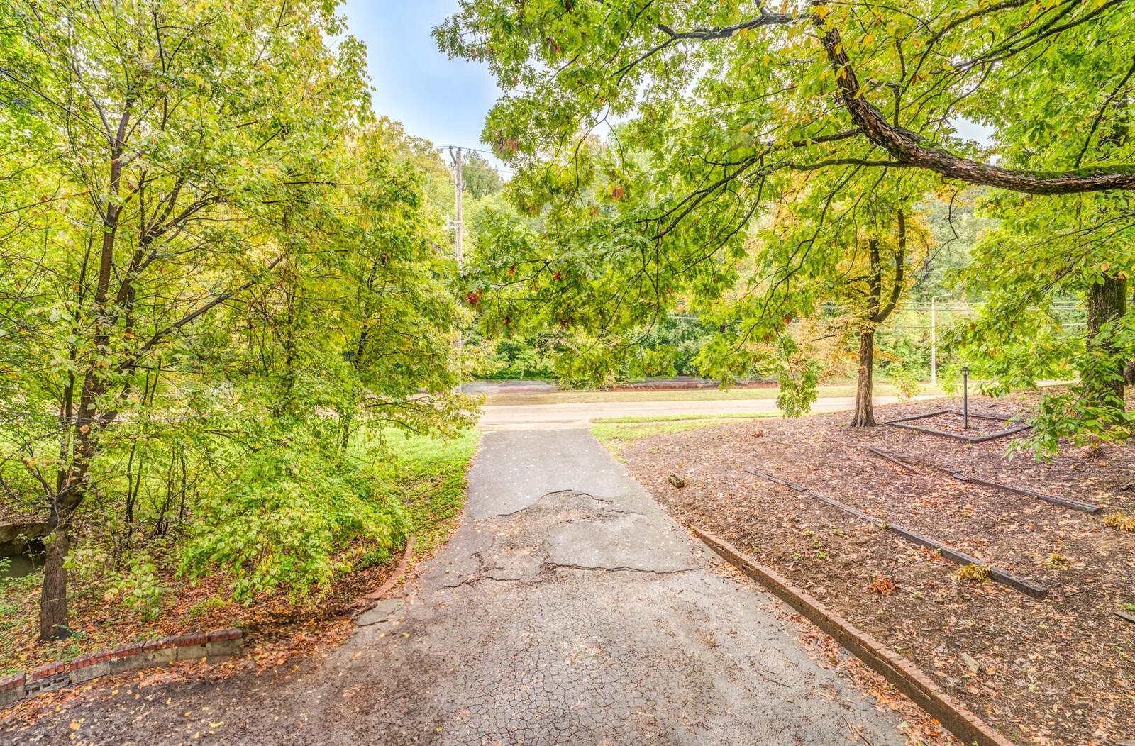2725 Covington Pike Memphis, TN 38128 - Photo 23 of 26 a view of yard with large trees and plants