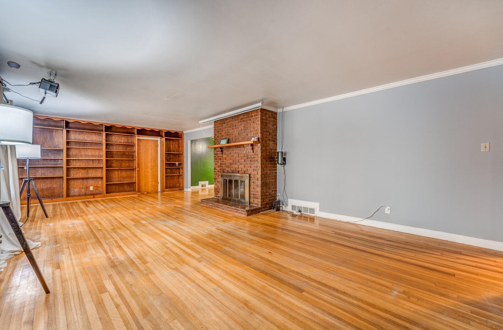 2725 Covington Pike Memphis, TN 38128 - Photo 24 of 26 a view of an empty room with wooden floor and a window