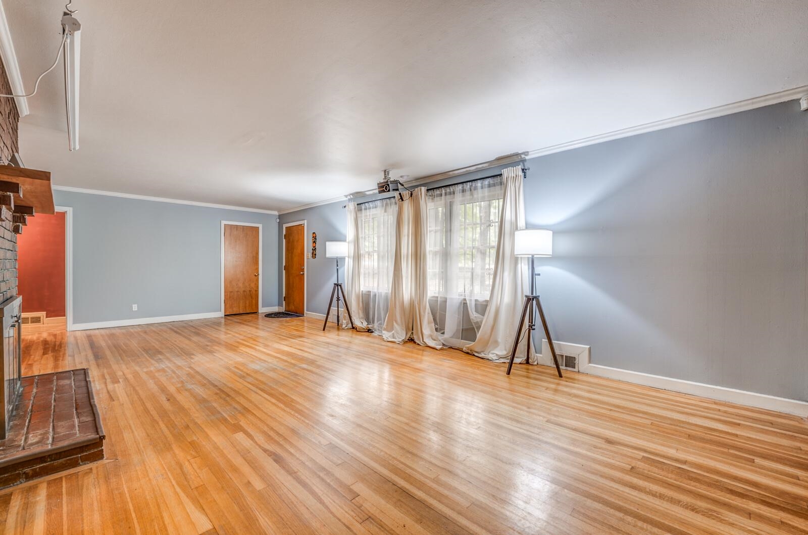 2725 Covington Pike Memphis, TN 38128 - Photo 25 of 26 a view of an empty room with wooden floor and a window
