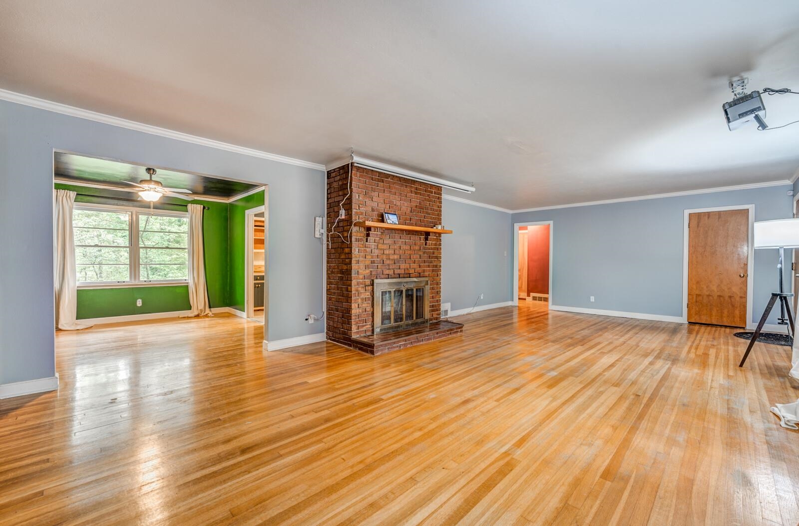 2725 Covington Pike Memphis, TN 38128 - Photo 26 of 26 a view of an empty room with window and wooden floor