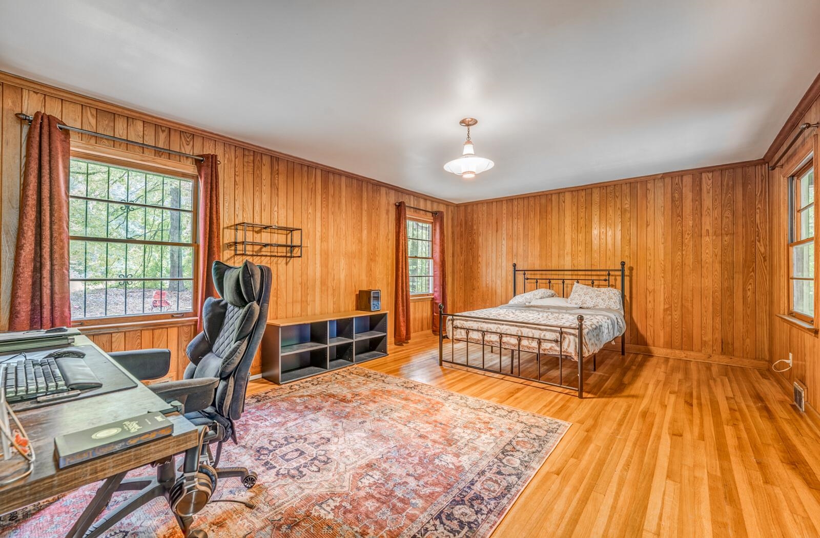 2725 Covington Pike Memphis, TN 38128 - Photo 5 of 26 a bedroom with furniture and a wooden floor