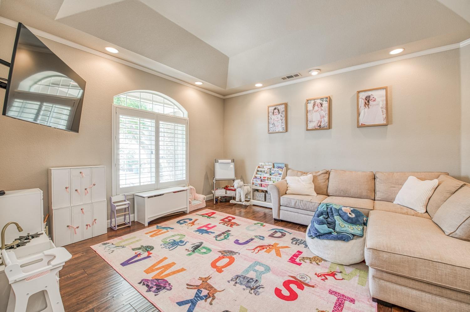 692 East Blue Ridge Road Fresno, CA 93725 - Photo 14 of 68 a living room with furniture and a window