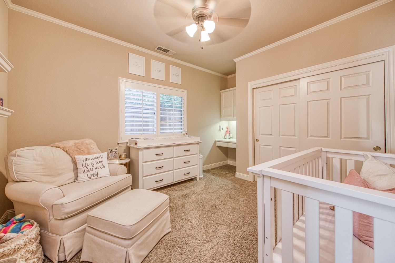 692 East Blue Ridge Road Fresno, CA 93725 - Photo 32 of 68 a living room with furniture and a window