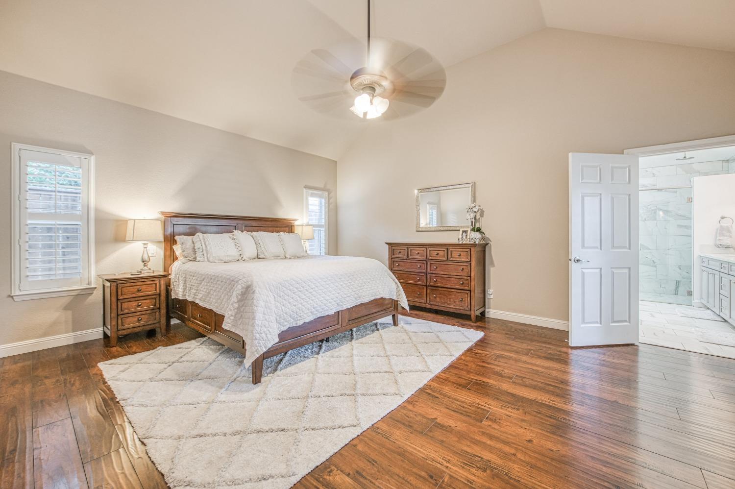 692 East Blue Ridge Road Fresno, CA 93725 - Photo 37 of 68 a bedroom with a bed and wooden floor