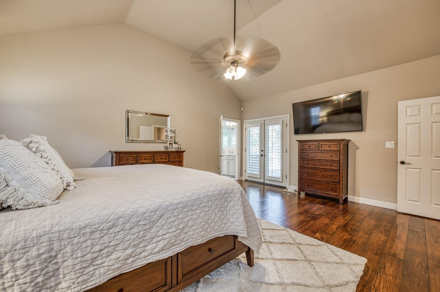 692 East Blue Ridge Road Fresno, CA 93725 - Photo 38 of 68 a bedroom with a bed and a flat screen tv