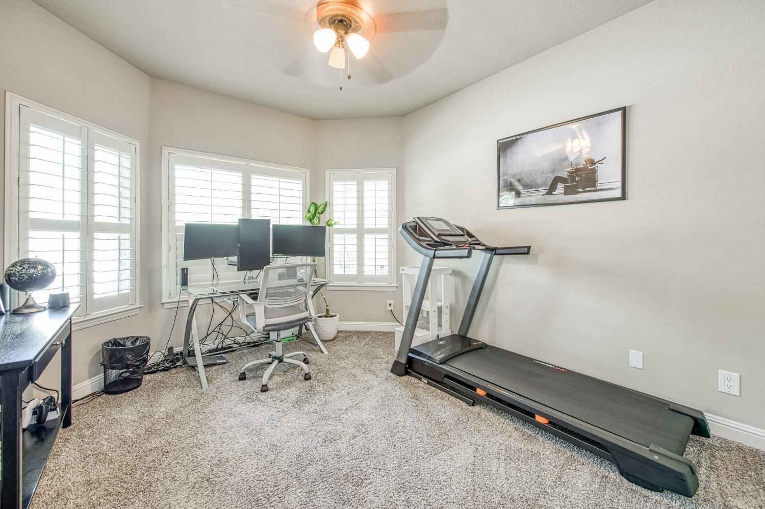 692 East Blue Ridge Road Fresno, CA 93725 - Photo 44 of 68 a view of a room with gym equipment