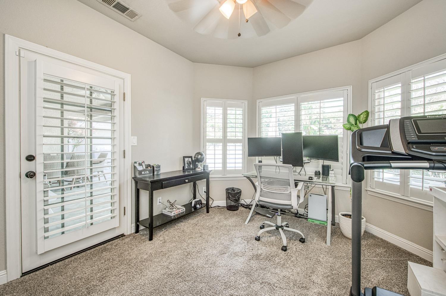692 East Blue Ridge Road Fresno, CA 93725 - Photo 45 of 68 a view of a livingroom with workspace and a window