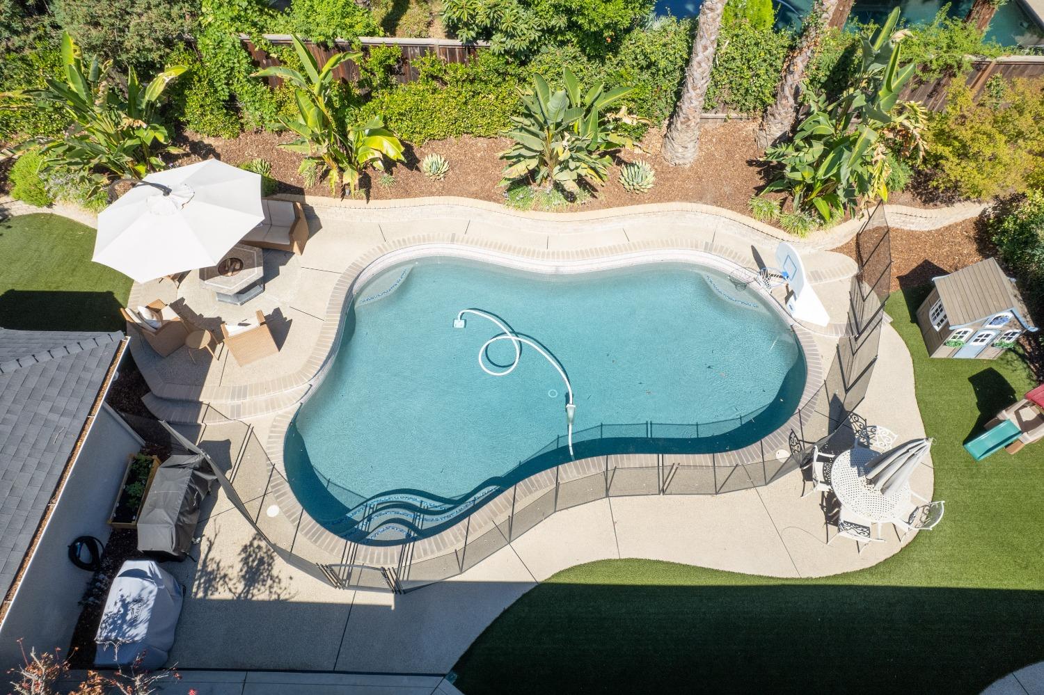 692 East Blue Ridge Road Fresno, CA 93725 - Photo 60 of 68 an aerial view of a swimming pool