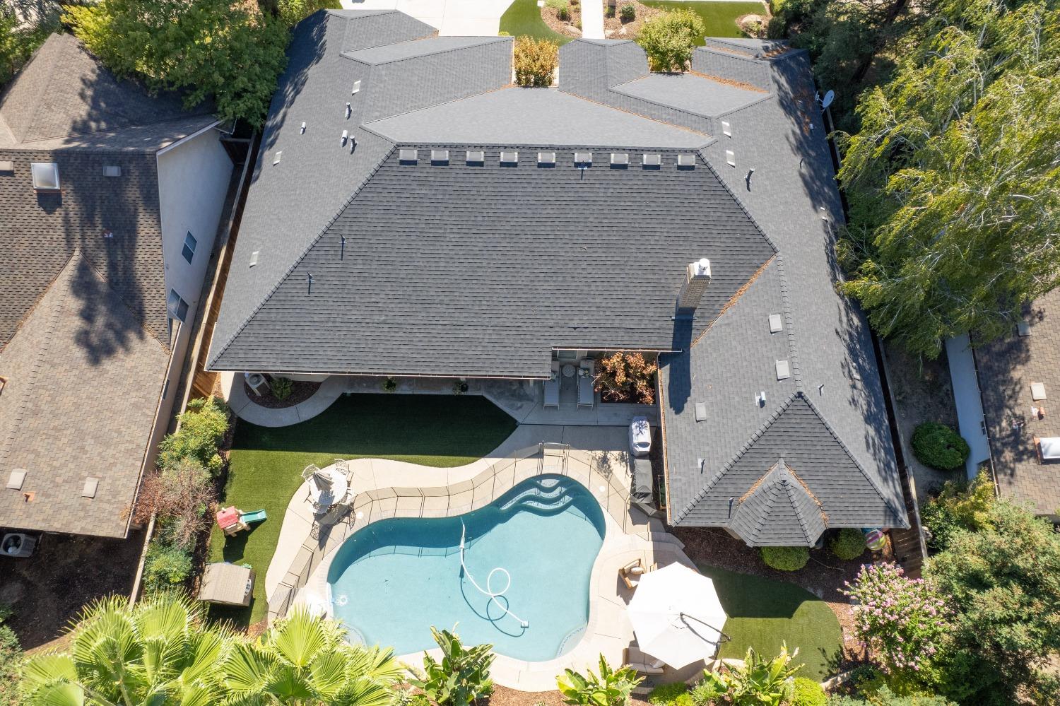 692 East Blue Ridge Road Fresno, CA 93725 - Photo 7 of 68 an aerial view of a house with a swimming pool