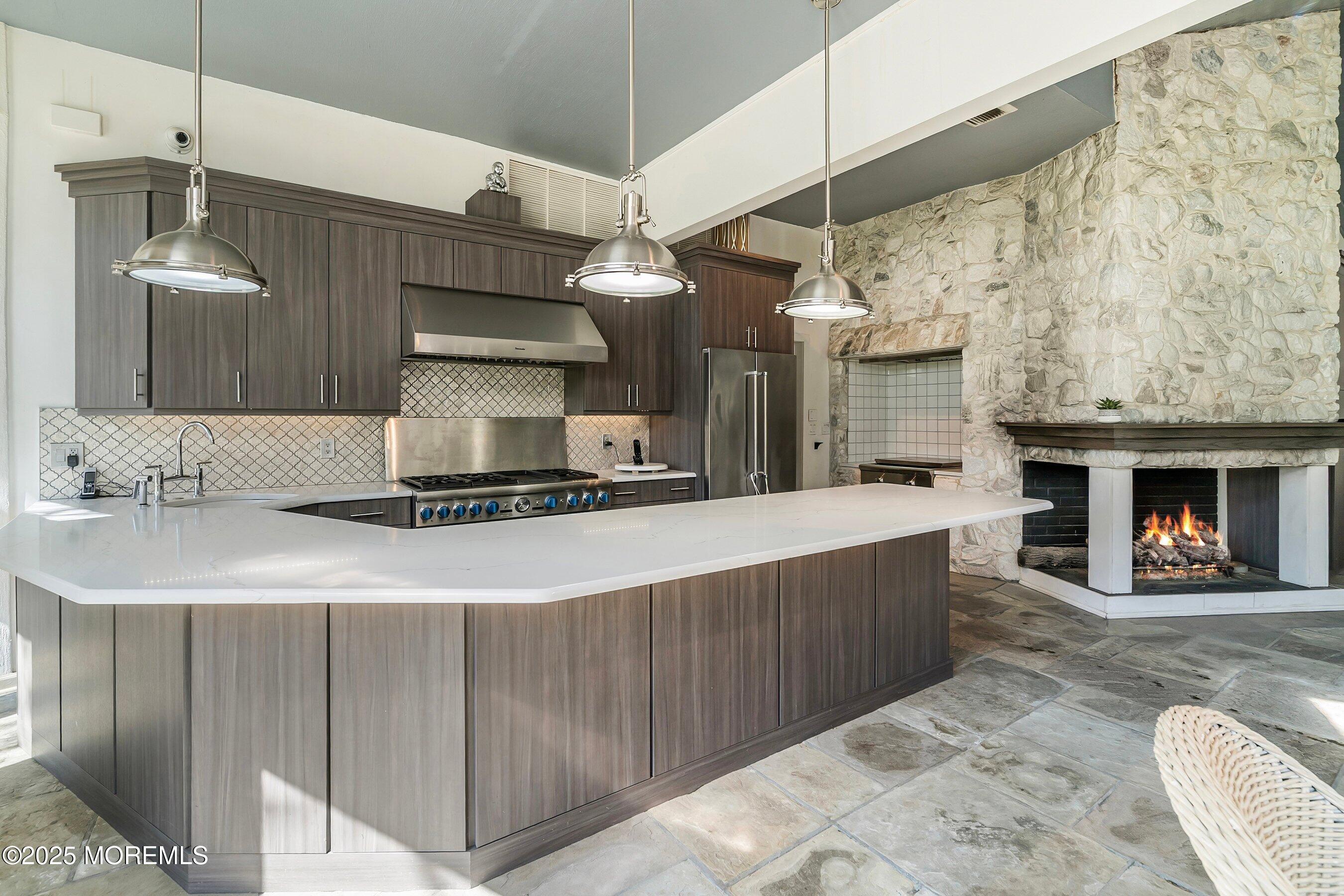 4 Colts Drive Holmdel, NJ 07733 - Photo 23 of 44 Pool Kitchen 1B with fire