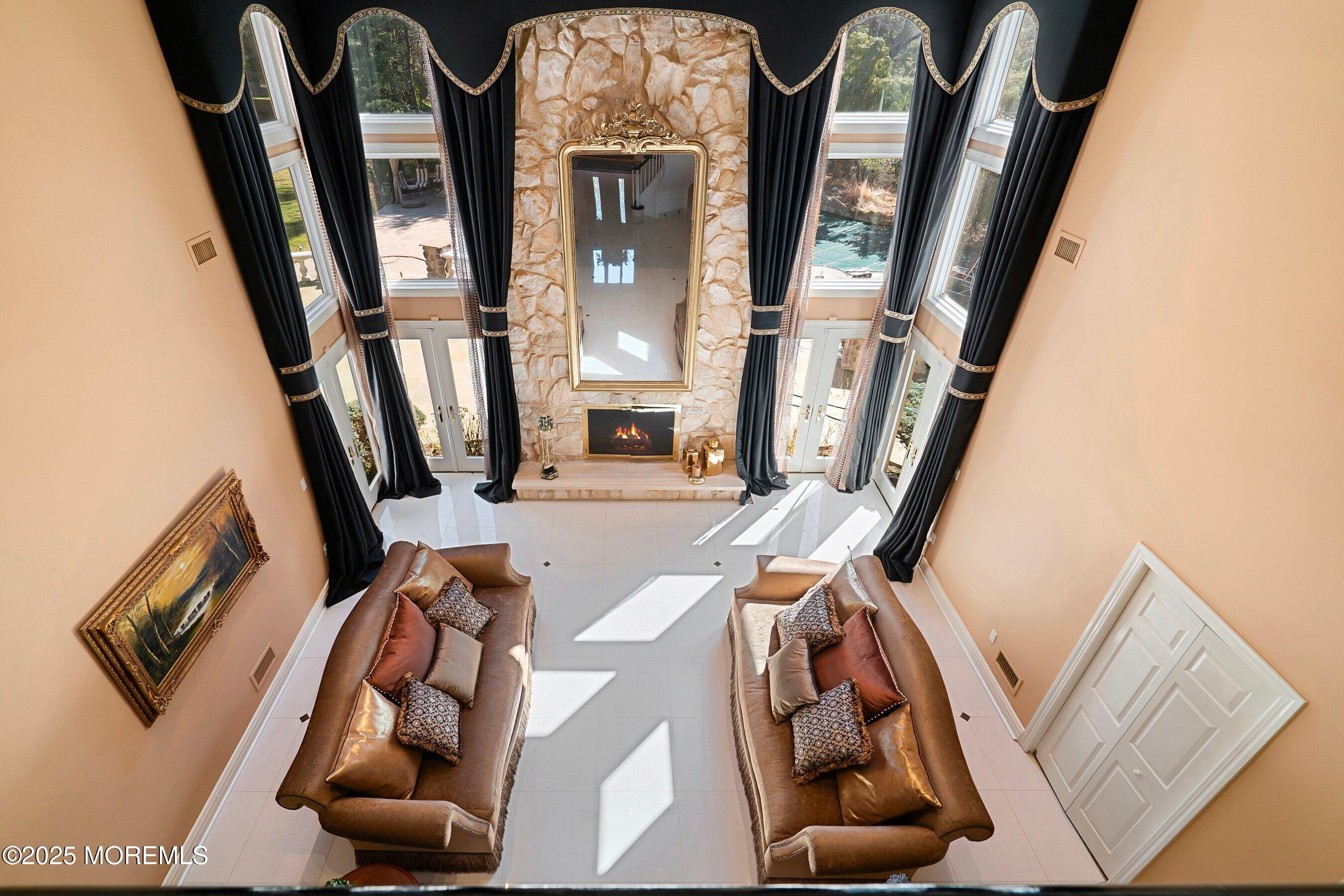 4 Colts Drive Holmdel, NJ 07733 - Photo 37 of 44 Living overhead with fire