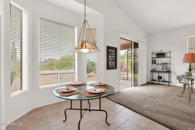a en suite bathroom with a sink double vanity and a mirror