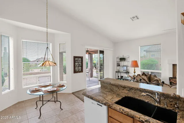 a view of an chairs and table in the patio