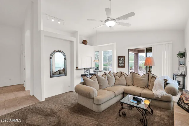 a view of a livingroom with furniture and window