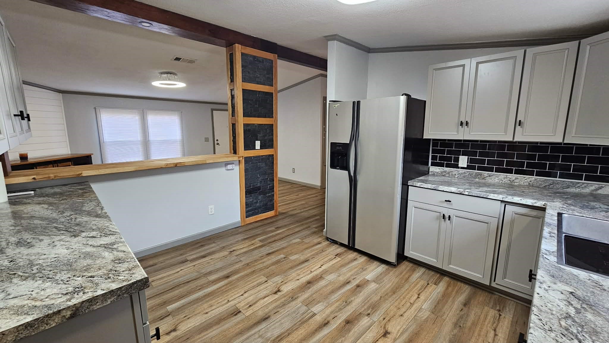 28183 Ramble Lane Hilliard, FL 32046 - Photo 13 of 34 a kitchen with stainless steel appliances granite countertop a refrigerator and a stove