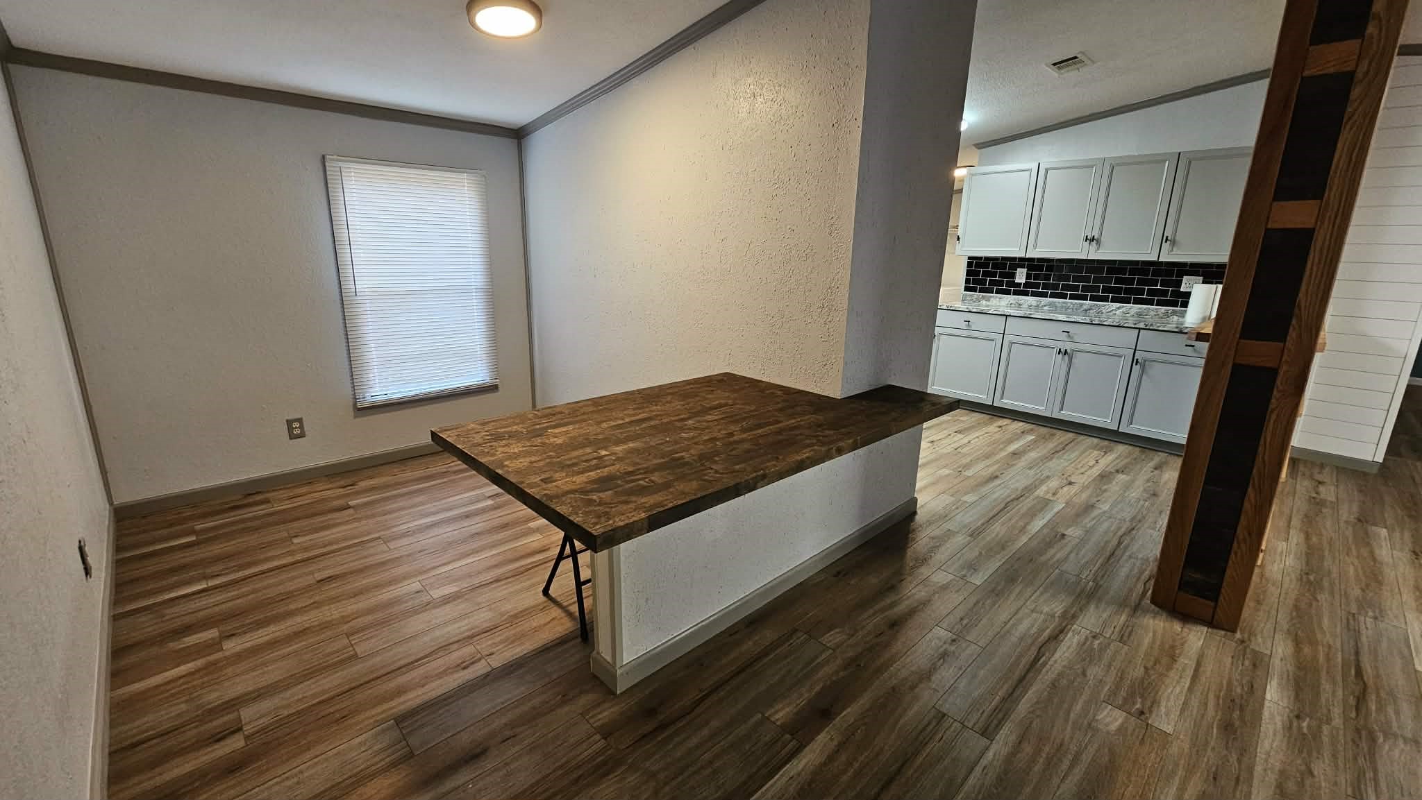 28183 Ramble Lane Hilliard, FL 32046 - Photo 18 of 34 a kitchen with granite countertop wooden floors and appliances