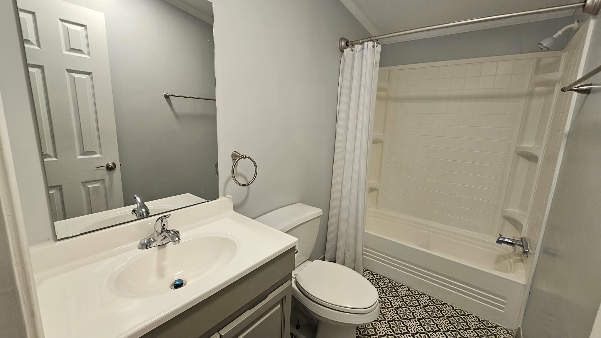 28183 Ramble Lane Hilliard, FL 32046 - Photo 19 of 34 a bathroom with a sink toilet and shower
