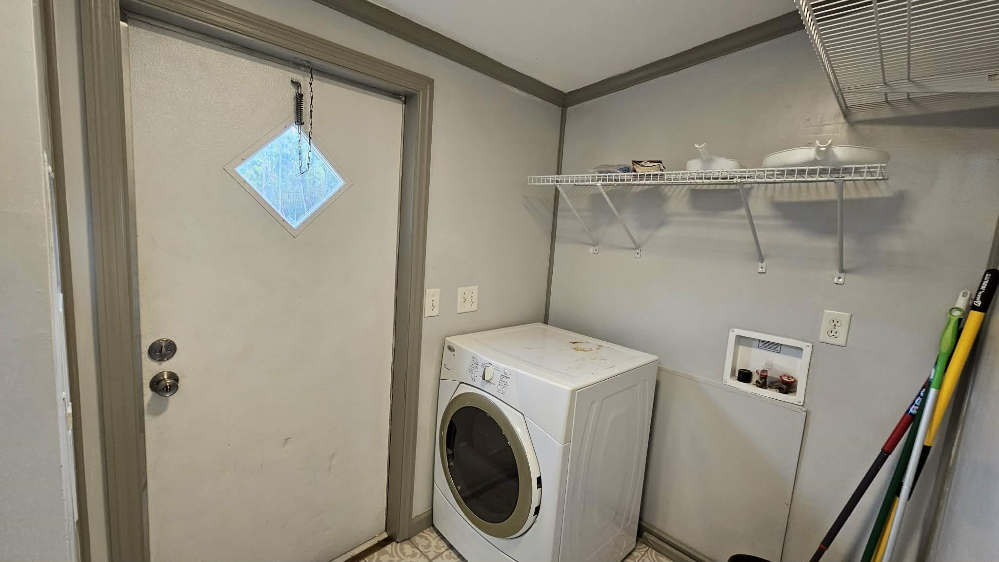 28183 Ramble Lane Hilliard, FL 32046 - Photo 20 of 34 a utility room with dryer and washer