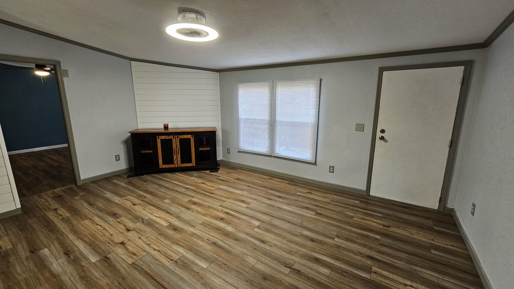 28183 Ramble Lane Hilliard, FL 32046 - Photo 22 of 34 a view of empty room with wooden floor and fireplace
