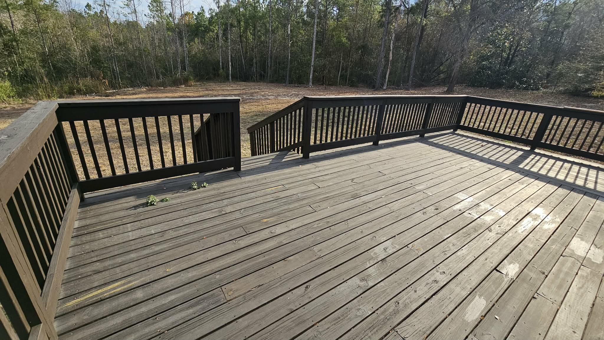 28183 Ramble Lane Hilliard, FL 32046 - Photo 26 of 34 a view of deck with wooden floor and fence