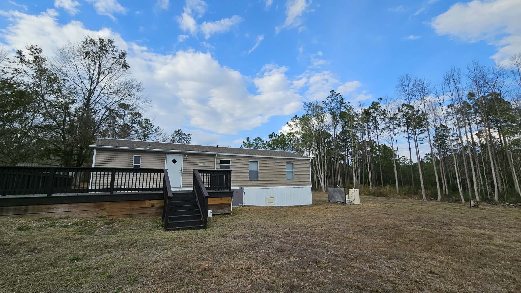 28183 Ramble Lane Hilliard, FL 32046 - Photo 27 of 34 a view of house with outdoor space and entertaining space