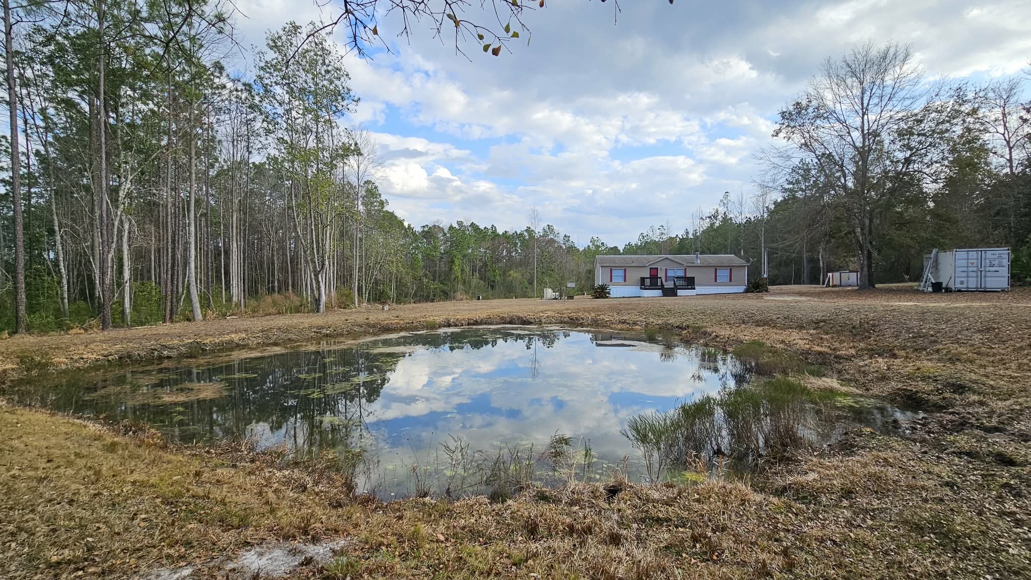 28183 Ramble Lane Hilliard, FL 32046 - Photo 29 of 34 a view of a yard with large trees