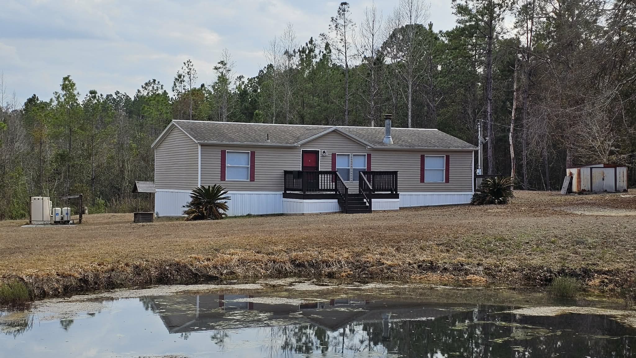 28183 Ramble Lane Hilliard, FL 32046 - Photo 30 of 34 a house with trees in the background