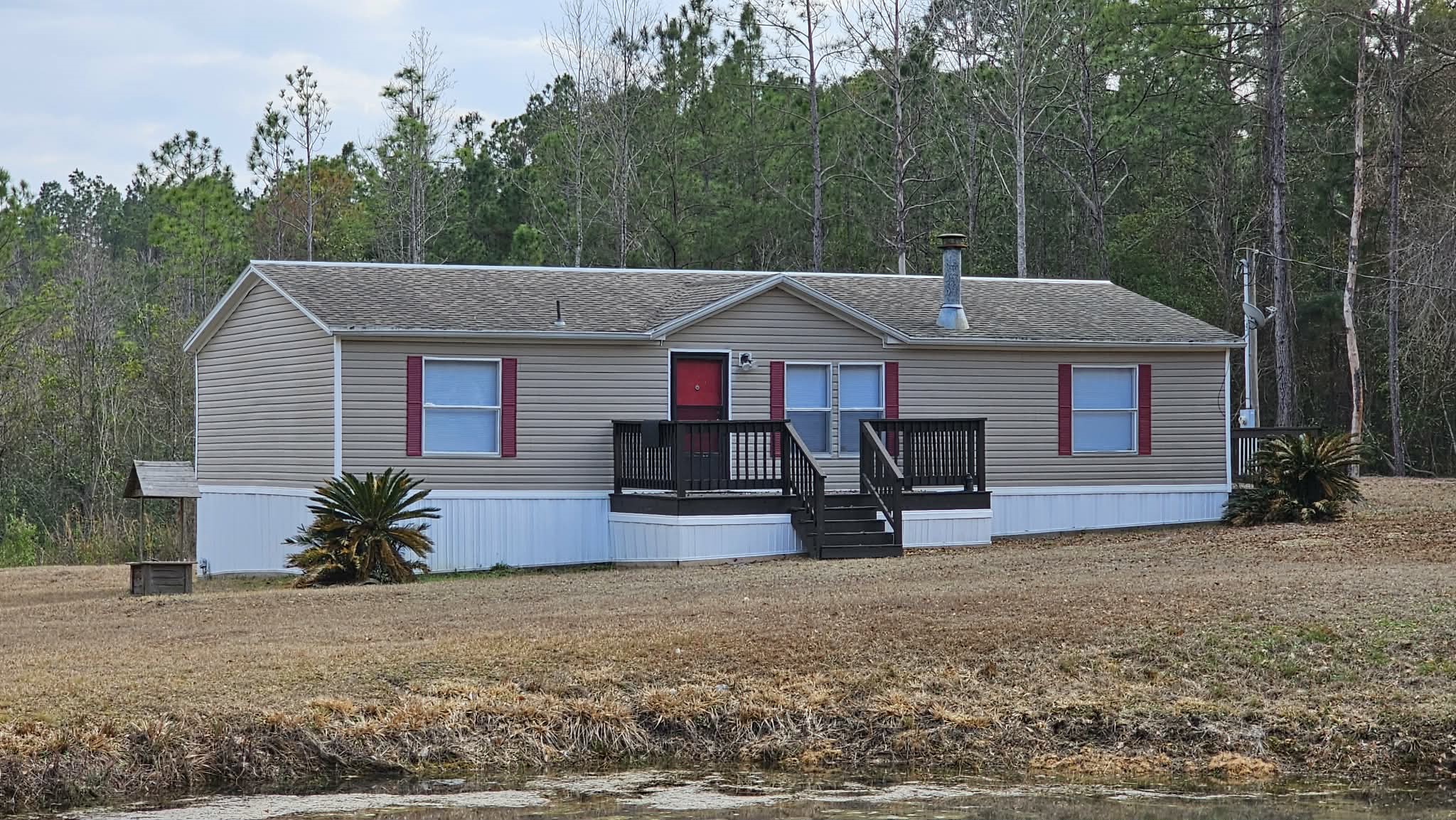 28183 Ramble Lane Hilliard, FL 32046 - Photo 3 of 34 a front view of a house with garden