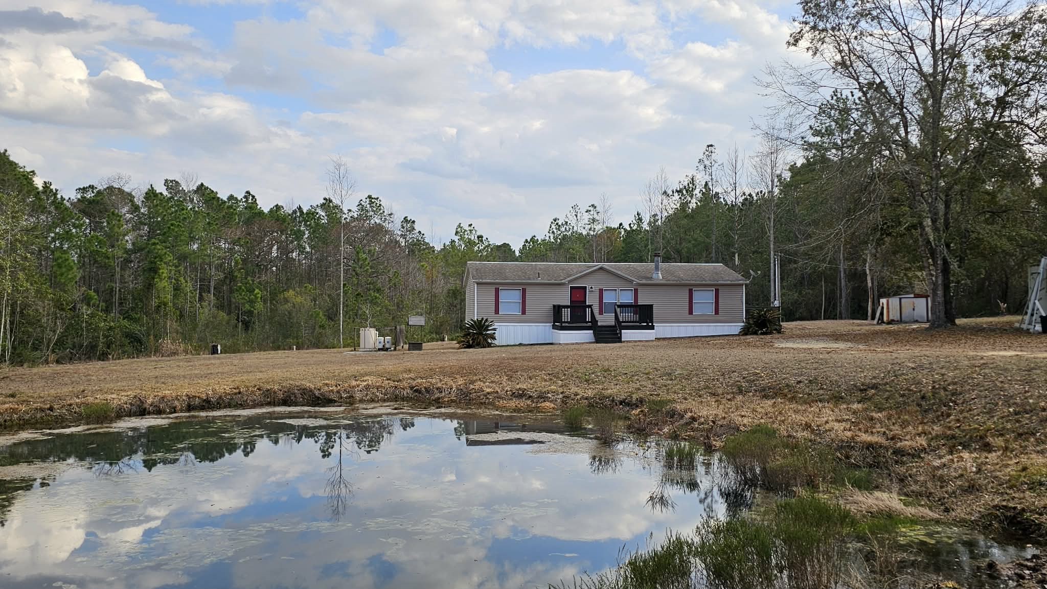 28183 Ramble Lane Hilliard, FL 32046 - Photo 31 of 34 a view of a town with trees & house in the background