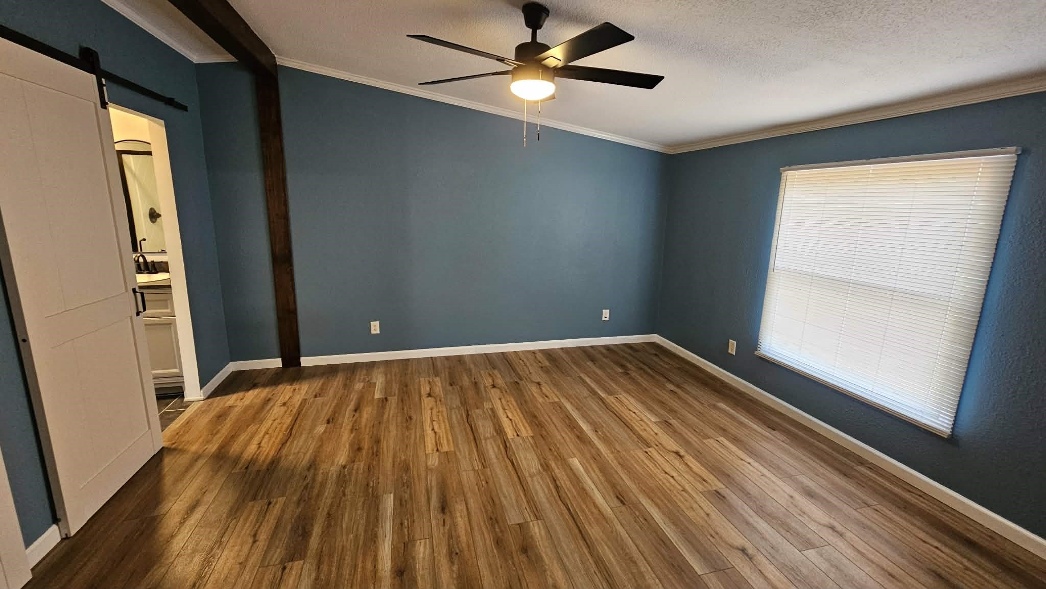 28183 Ramble Lane Hilliard, FL 32046 - Photo 8 of 34 wooden floor in an empty room with a window