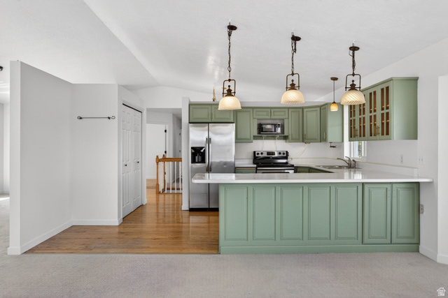 380 Luzern Road Midway, UT 84049 - Photo 12 of 74 Kitchen featuring mint green cabinetry, stainless steel appliances, a white countertop, and three pendant lights