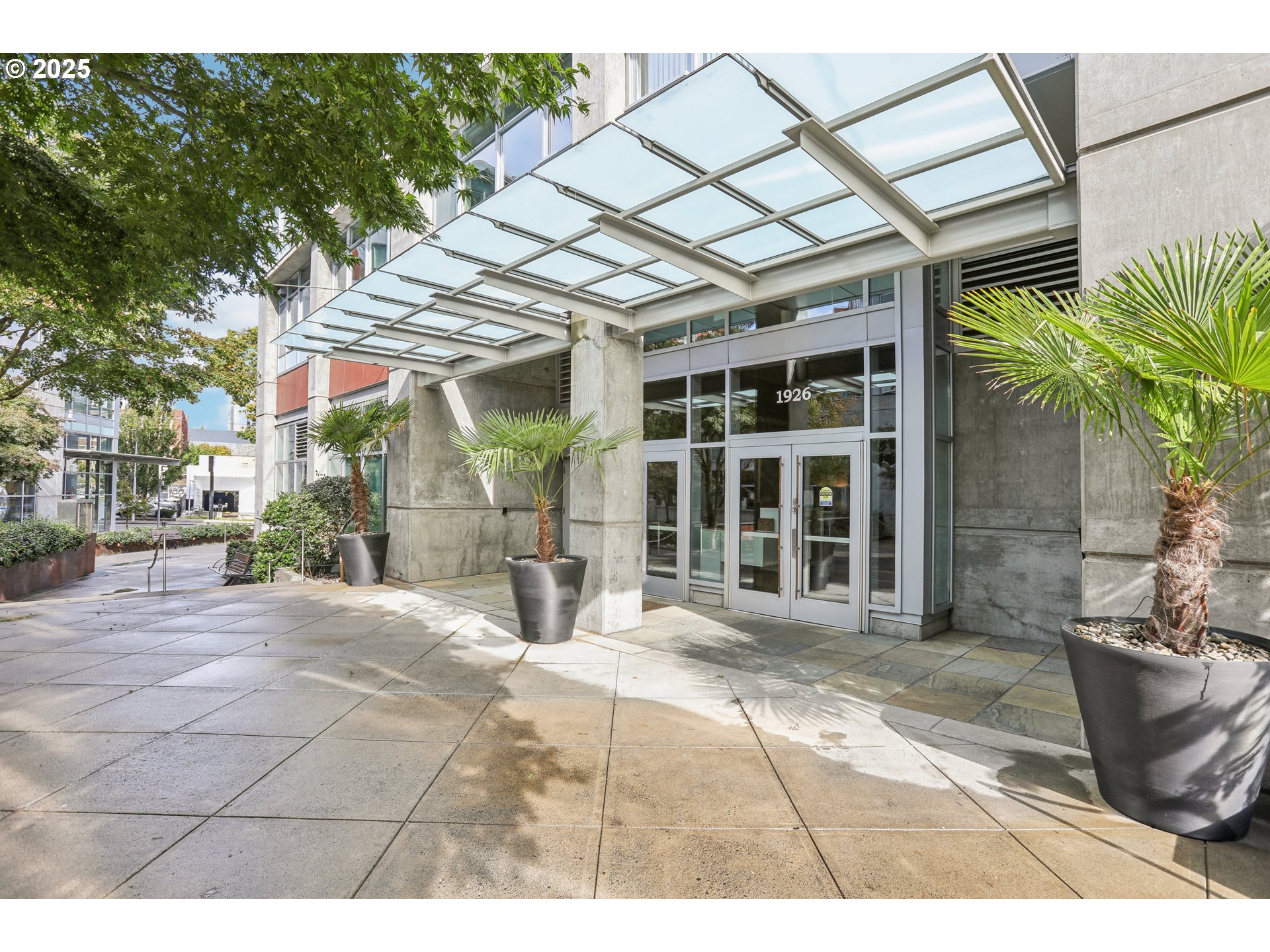 1926 West Burnside Street, Unit 912 Portland, OR 97209 - Photo 2 of 19 a view of a backyard with a patio and a yard