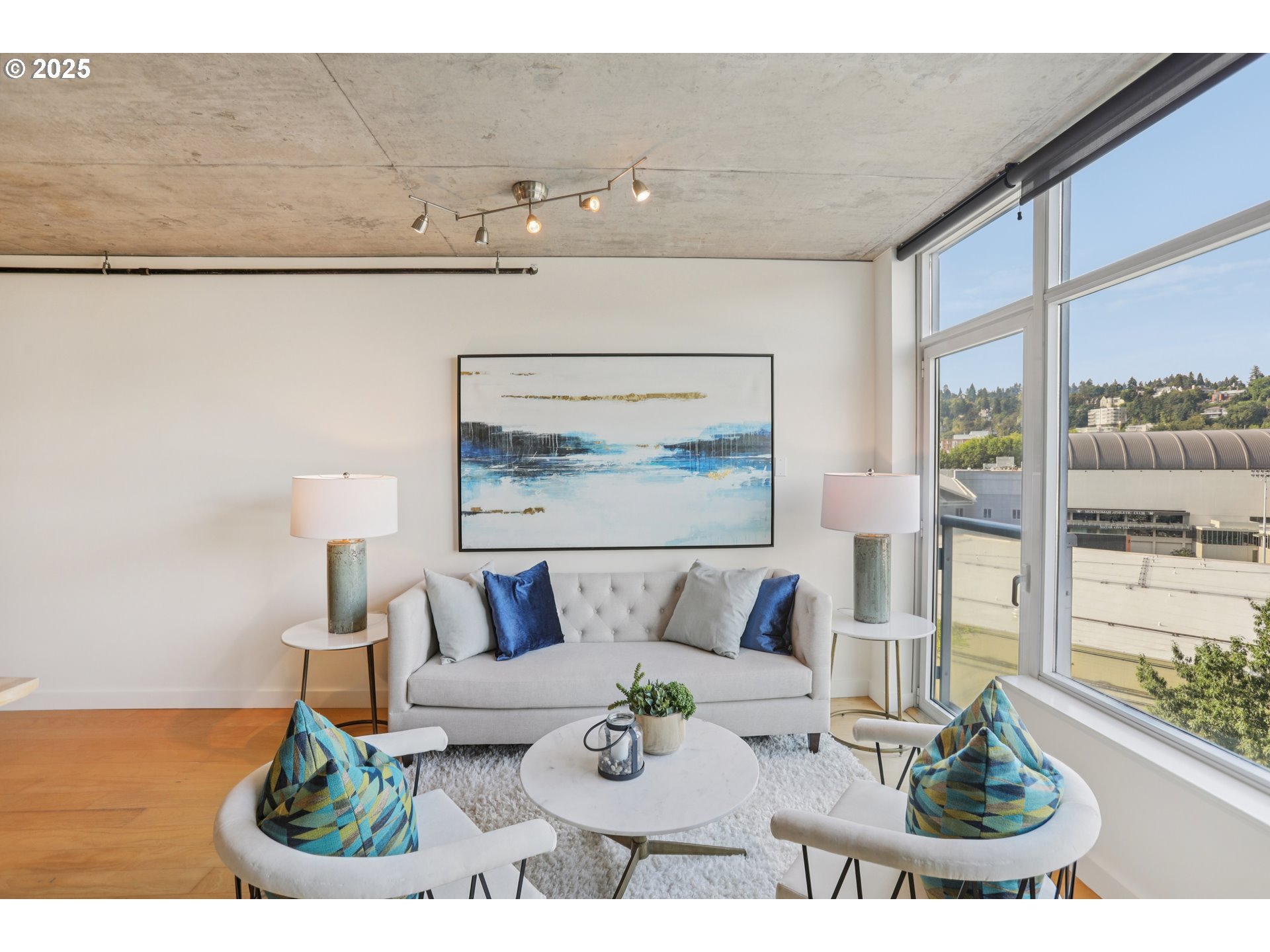1926 West Burnside Street, Unit 912 Portland, OR 97209 - Photo 5 of 19 a view of a living room and kitchen with furniture