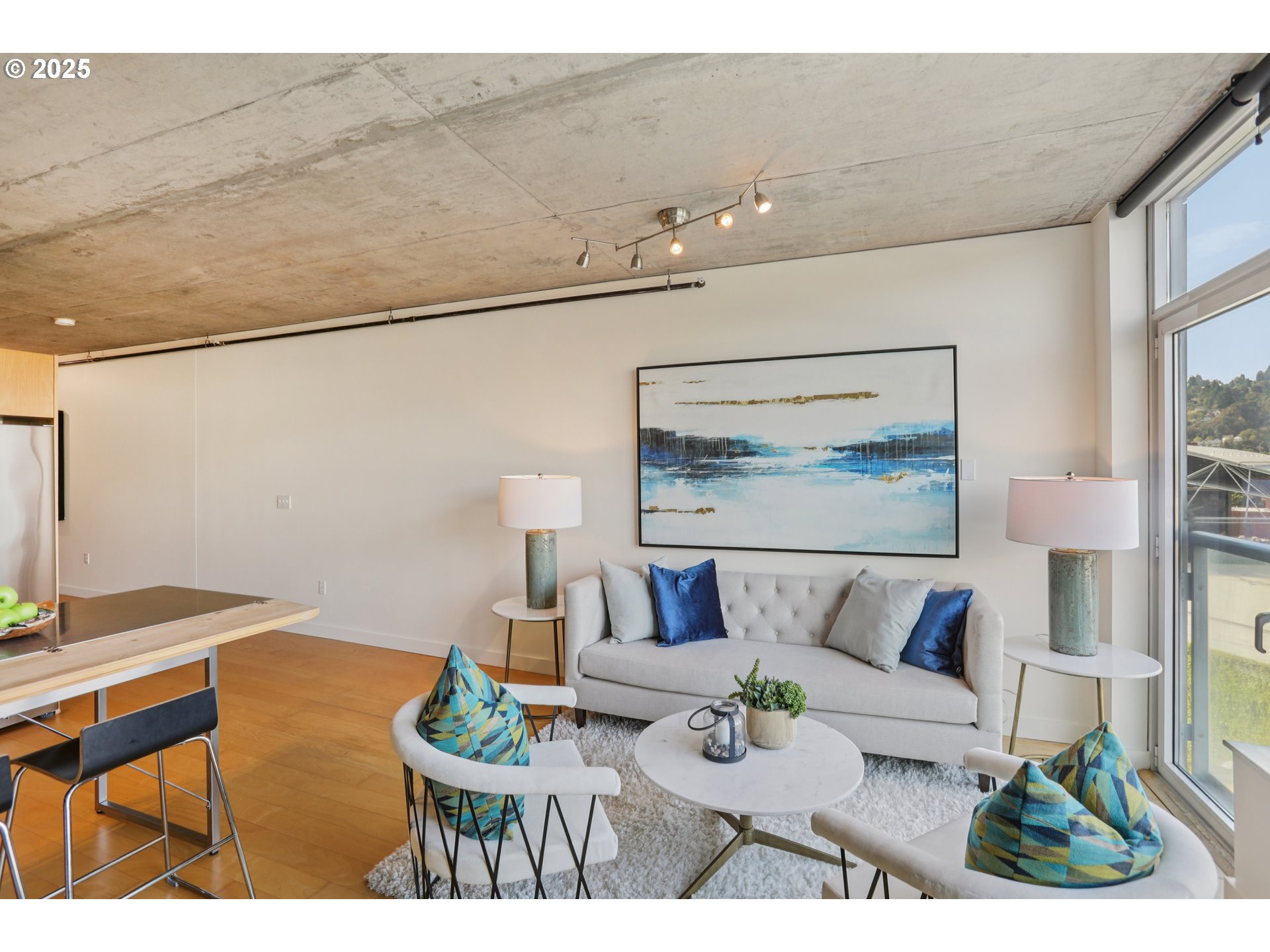 1926 West Burnside Street, Unit 912 Portland, OR 97209 - Photo 6 of 19 a living room with furniture and a table