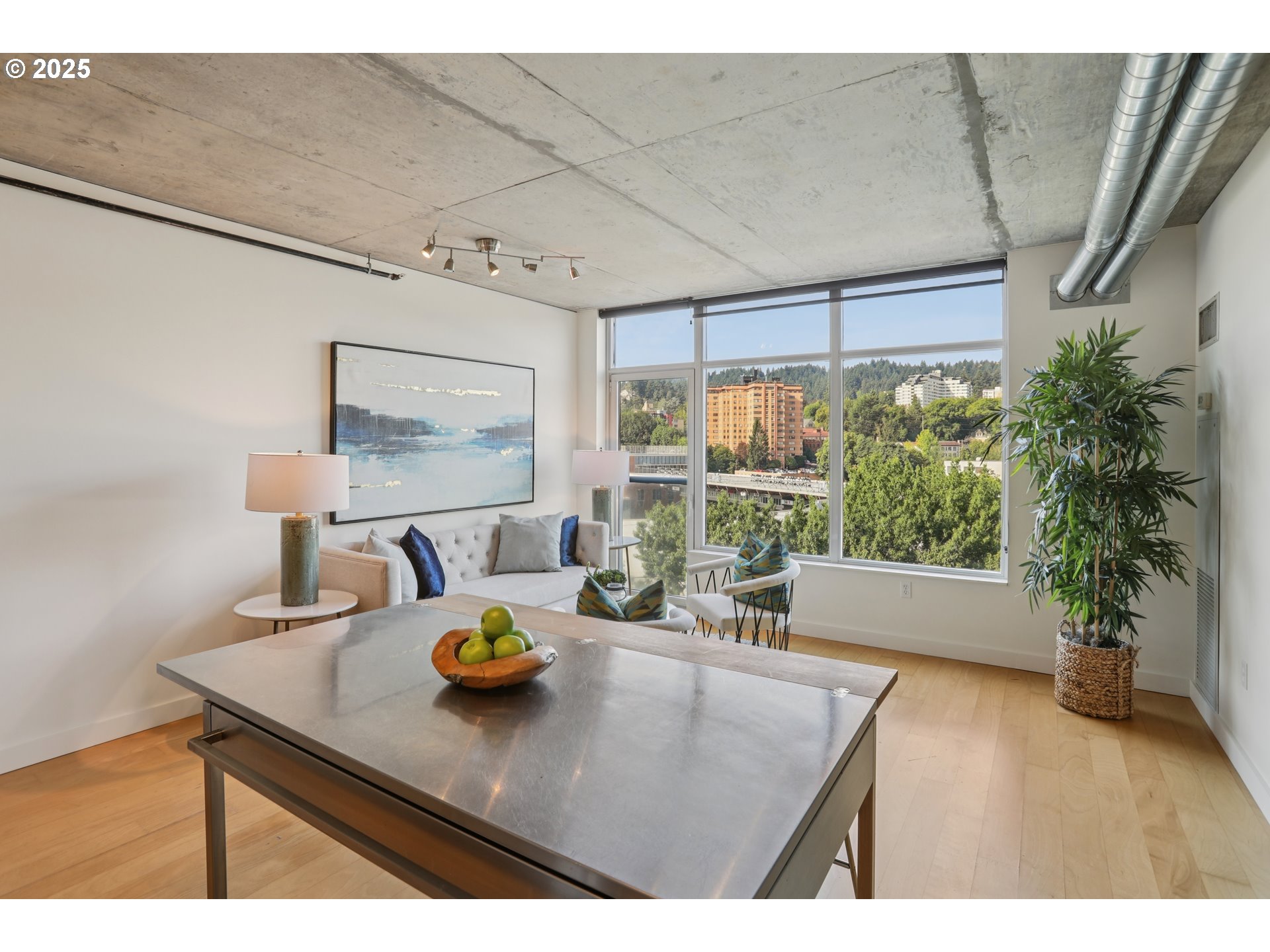 1926 West Burnside Street, Unit 912 Portland, OR 97209 - Photo 8 of 19 a view of kitchen with furniture and wooden floor