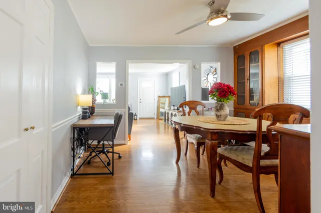 a view of a dining room with furniture and window