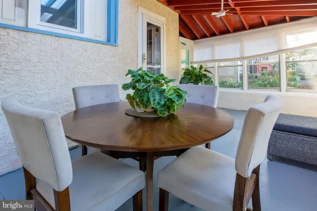 a view of a dining room with furniture and window