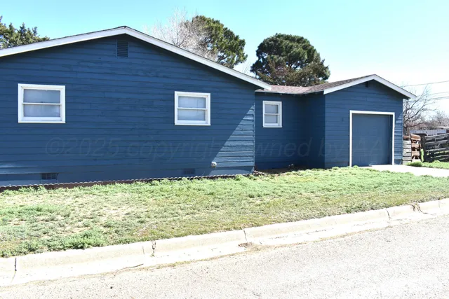 a brick house with a large windows