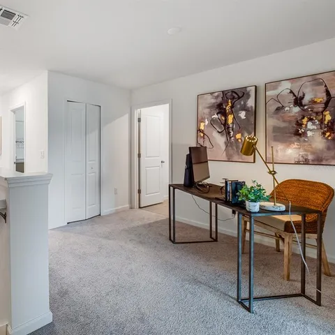 a bedroom with a bed and a couch