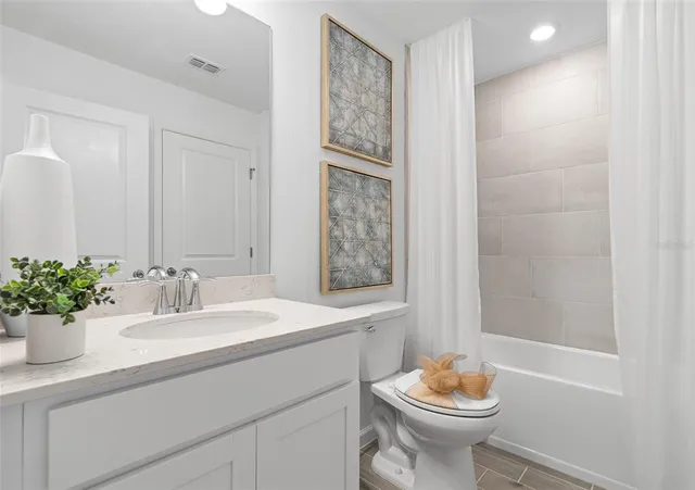 a kitchen with a dining table chairs and refrigerator