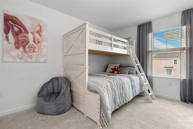 a kitchen with a sink and living room view