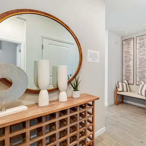 a view of living room with furniture and wooden floor