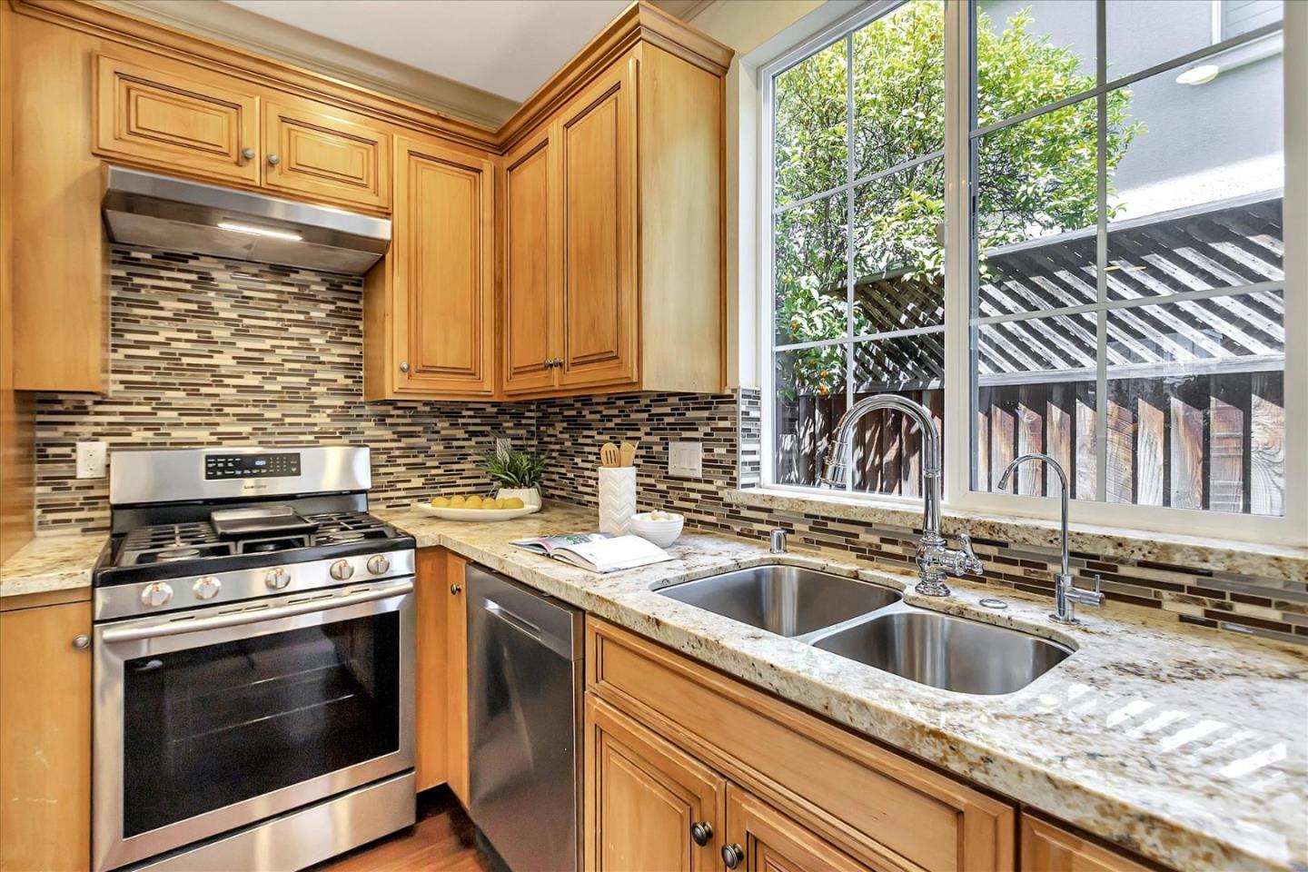 184 Redding Road Campbell, CA 95008 - Photo 11 of 34 a kitchen that has a sink and a stove