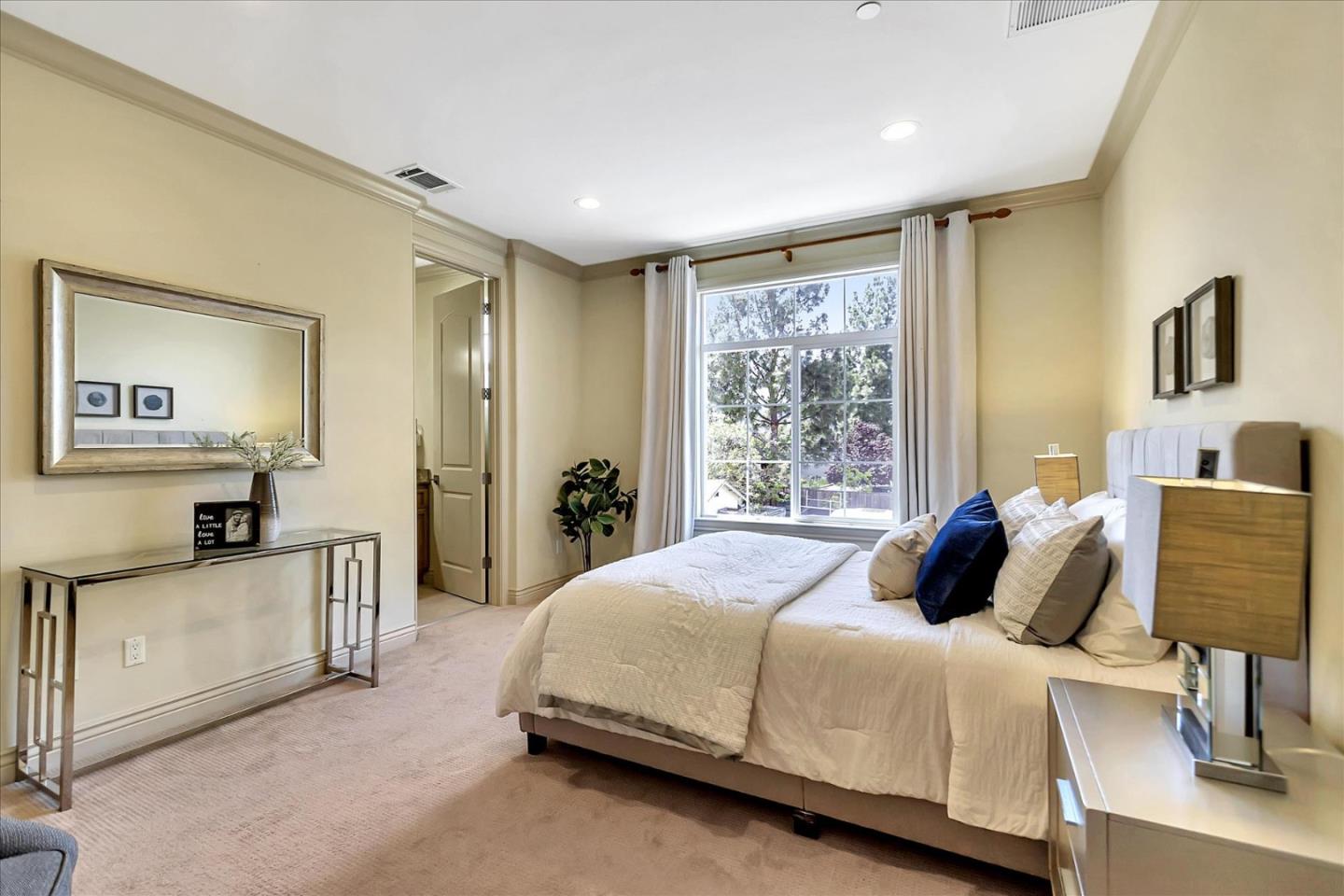 184 Redding Road Campbell, CA 95008 - Photo 18 of 34 a bedroom with a bed and wooden floor