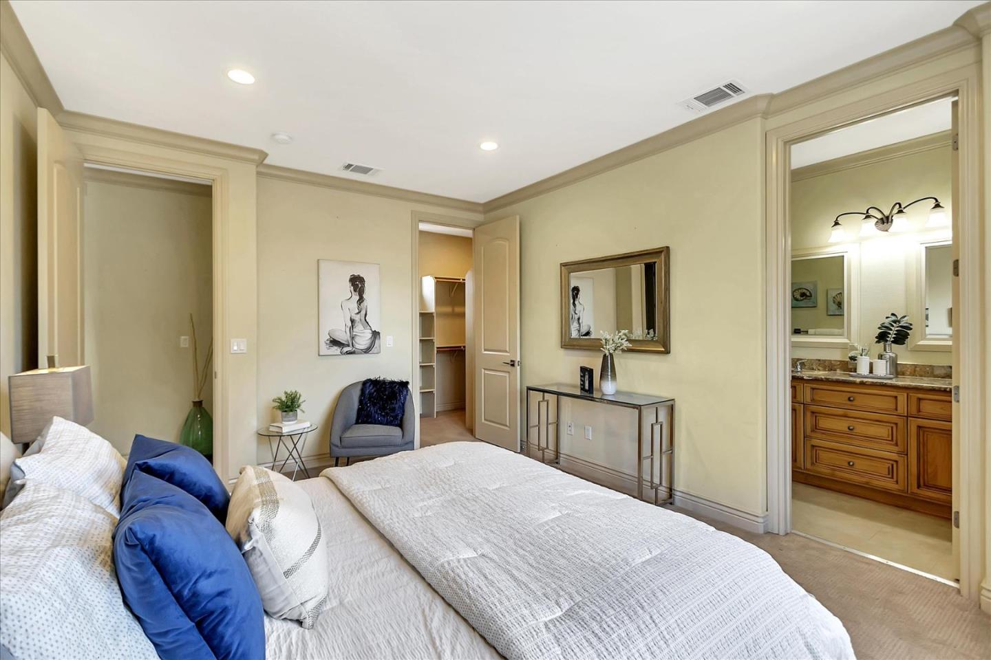 184 Redding Road Campbell, CA 95008 - Photo 19 of 34 a bedroom with a bed and dresser with mirror