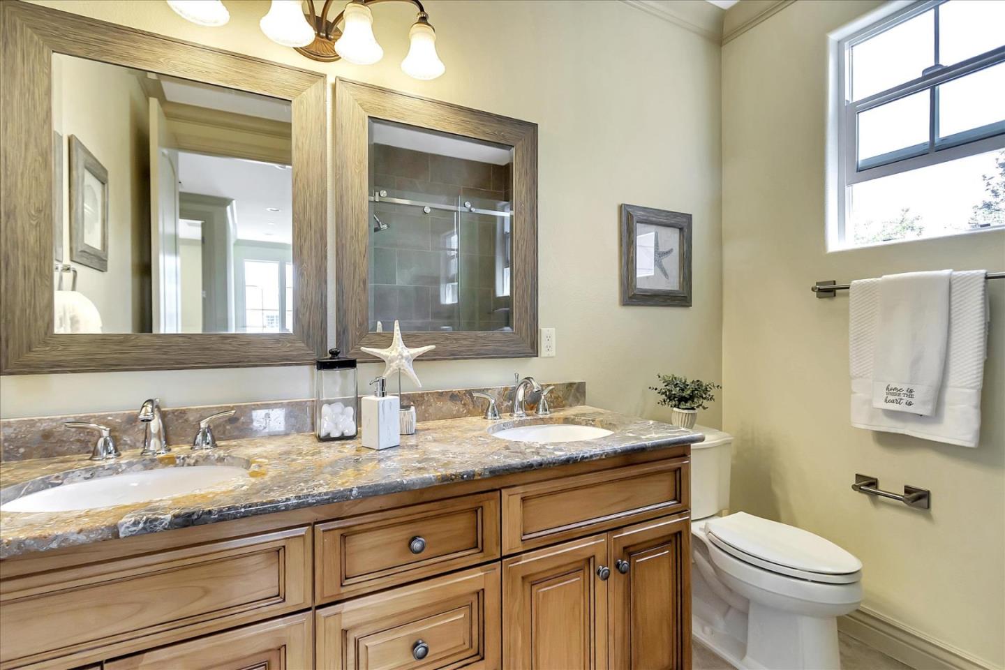 184 Redding Road Campbell, CA 95008 - Photo 25 of 34 a bathroom with a granite countertop toilet sink and mirror