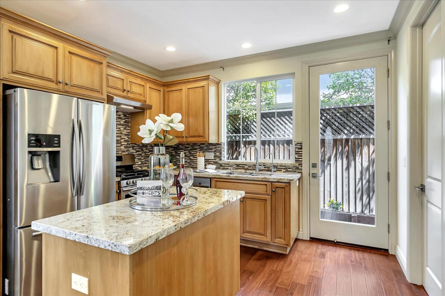 184 Redding Road Campbell, CA 95008 - Photo 7 of 34 a kitchen with stainless steel appliances granite countertop a sink stove and refrigerator