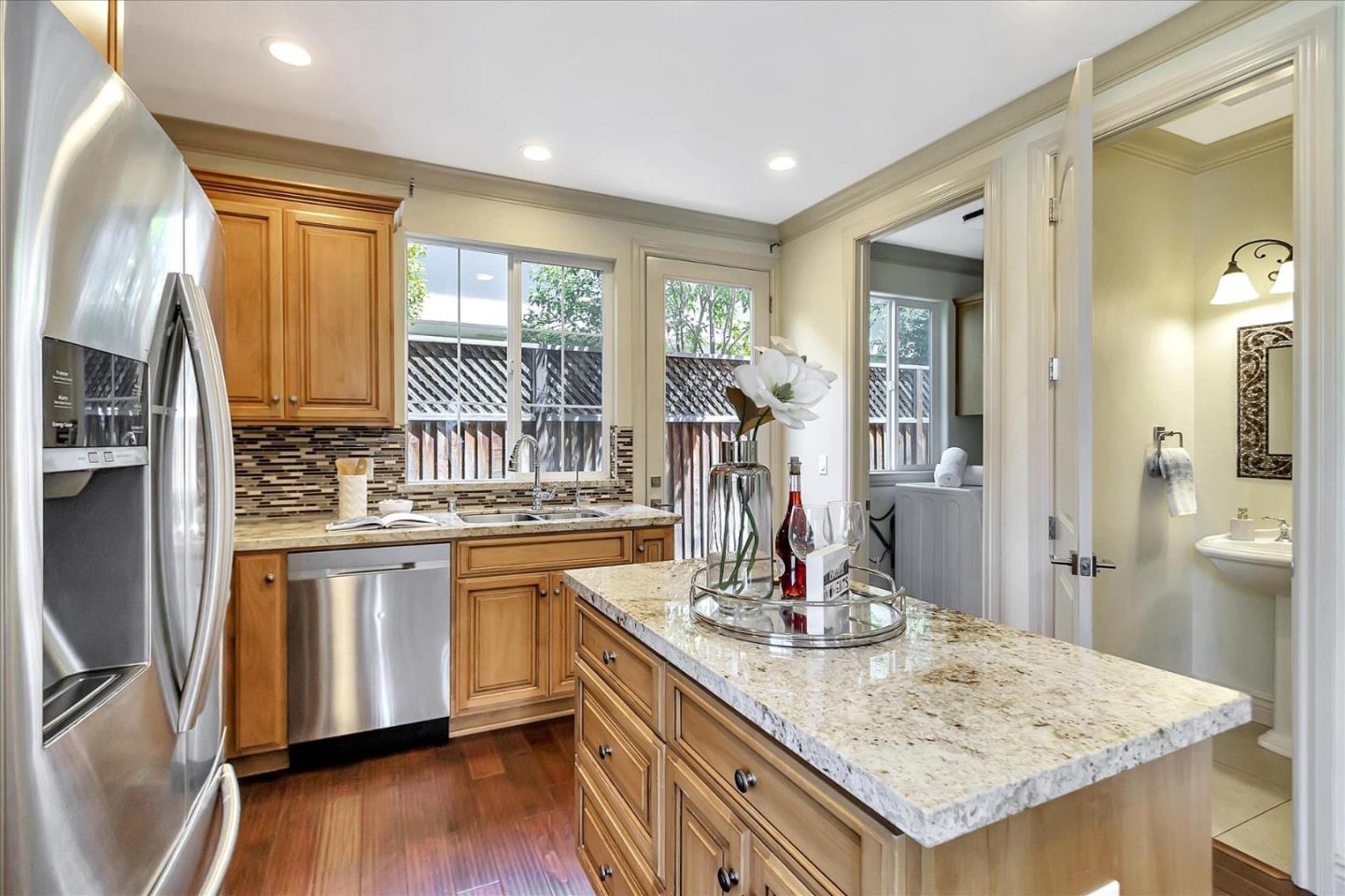 184 Redding Road Campbell, CA 95008 - Photo 10 of 34 a kitchen with stainless steel appliances granite countertop a sink and oven